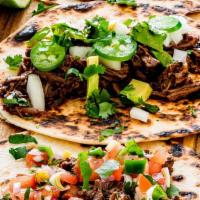 Barbacoa And Side · 3 Shredded beef tacos on soft corn tortillas, shredded cabbage and queso fresco