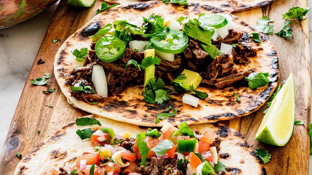 Barbacoa And Side · 3 Shredded beef tacos on soft corn tortillas, shredded cabbage and queso fresco
