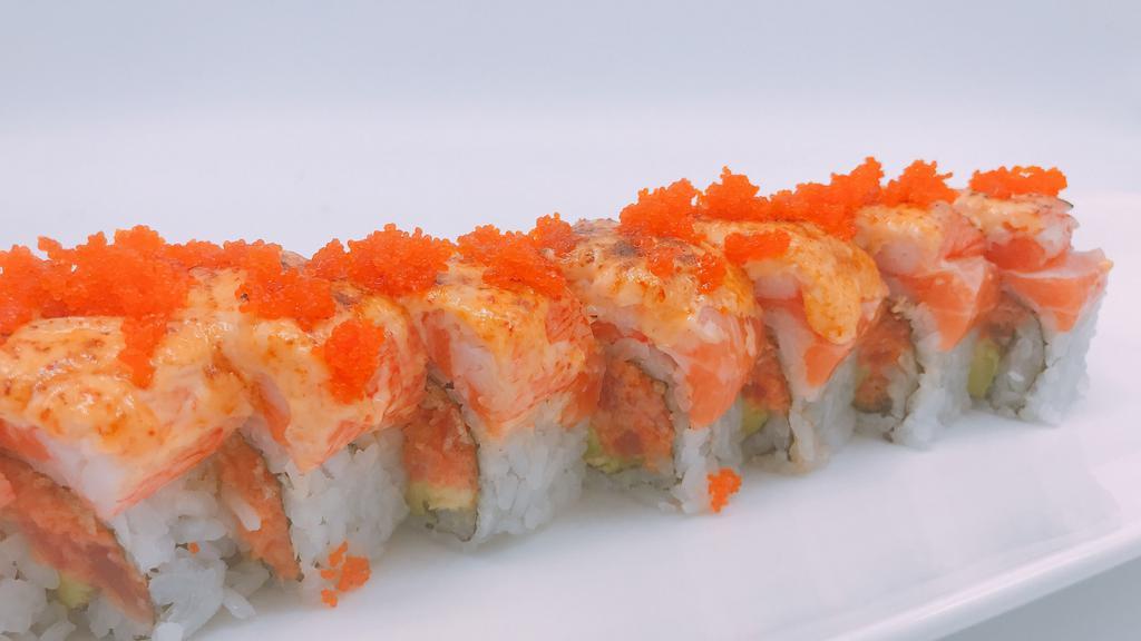 Volcano Roll · Spicy tuna, avocado inside, salmon bake with spicy crabmeat & tobiko on top.