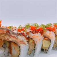 Snow Beauty Roll · Lobster tempura, spicy tuna and avocado inside, crunch spicy scallop on top.