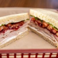 Turkey Cranberry · Turkey, cranberry sauce, cream cheese, red onion, lettuce and tomato.