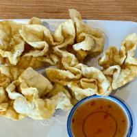 Crab Wontons (7) · Imitation crab and cream cheese stuffed in wonton wrapper and deep fried. Served with sweet ...