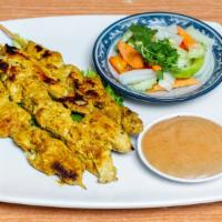 Chicken Satay (4) · Chicken breast marinated in curry powder and grilled on bamboo skewers. Served with a cucumb...