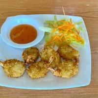 Coconut Prawns (6) · Prawns coated in shredded coconut and deep fried. Served with sweet chili sauce.