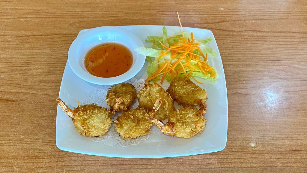 Coconut Prawns (6) · Prawns coated in shredded coconut and deep fried. Served with sweet chili sauce.