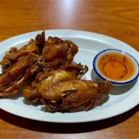 Chicken Wings (5-6) · Seasoned and deep fried. Served with sweet chili sauce.