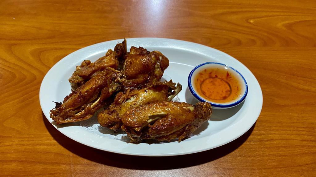 Chicken Wings (5-6) · Seasoned and deep fried. Served with sweet chili sauce.