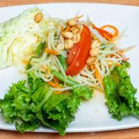 Papaya Salad (Som Tum) · Shredded green papaya and carrots mixed with tomato and tossed in a lime dressing. Choose fr...