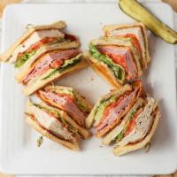 Deli Clubhouse · Deli clubhouse turkey, ham, bacon, tomato, lettuce, swiss, cheddar and mayo layered between ...