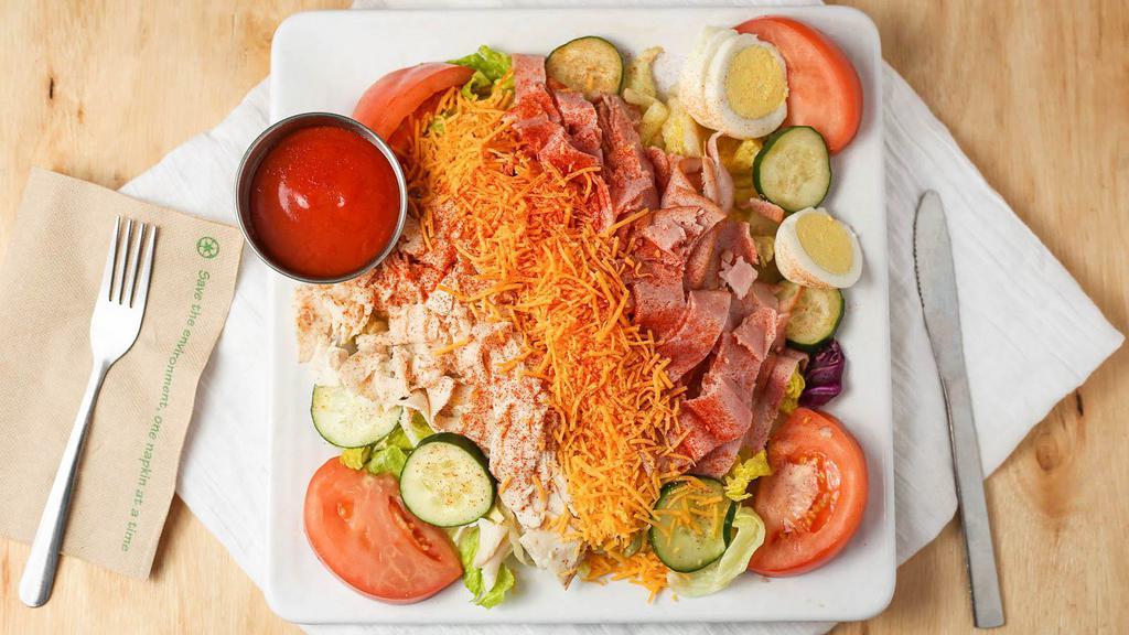 Skyline Chef Salad · Iceberg and romaine blend topped with fresh turkey, ham, hard-boiled egg, cucumber, tomatoes and cheese.