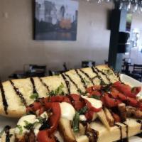 Amici Balsamic Chicken Sub · Chicken cutlet, roasted red peppers, fresh mozzarella, balsamic glaze & olive oil.
