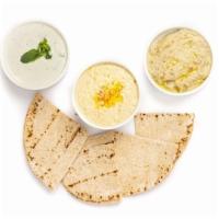 Trio Dip · Hummus, Baba Ganoush, Tzatziki, and Pita Bread. Replace Tzatziki with aubergine salad (tomat...
