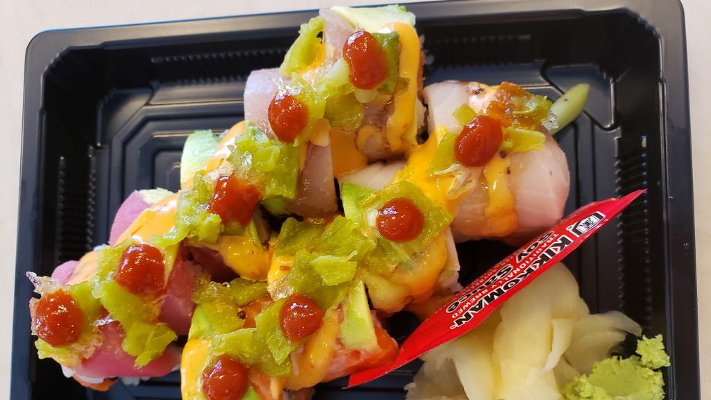 Volcano Roll (Spicy) · Spicy tuna, avocado topped with assorted fish, green chili, hot sauce, spicy mayo