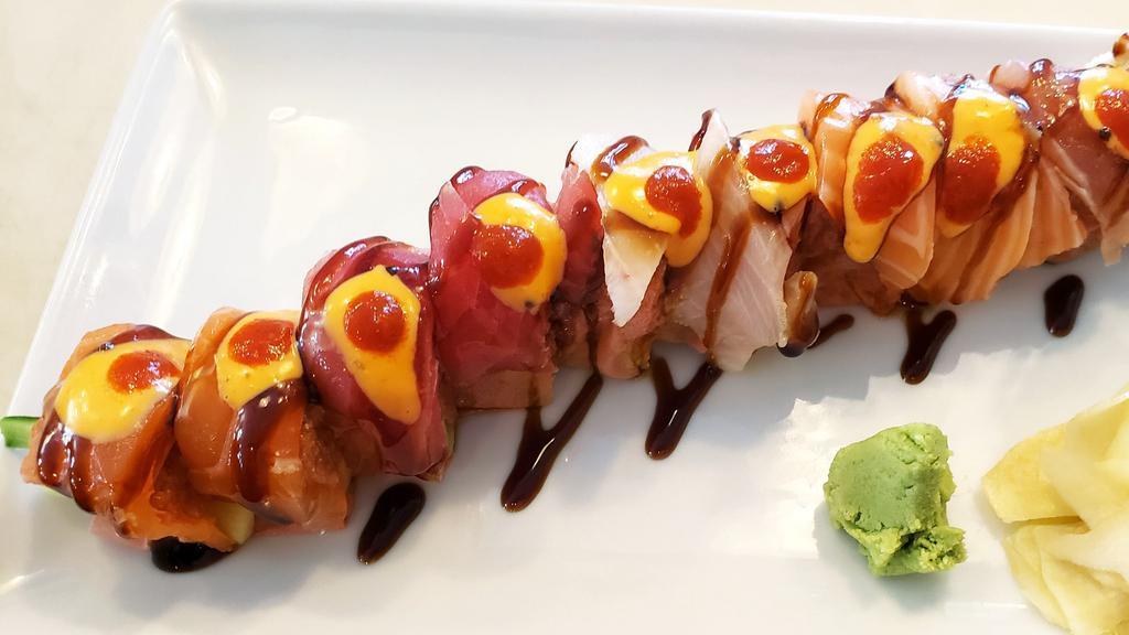 Protein Roll (Spicy) · (8pcs) avocado, cucumber, crab, spicy tuna wrapped soy paper topped with assorted fish, spicy mayo, unagi sauce, hot sauce