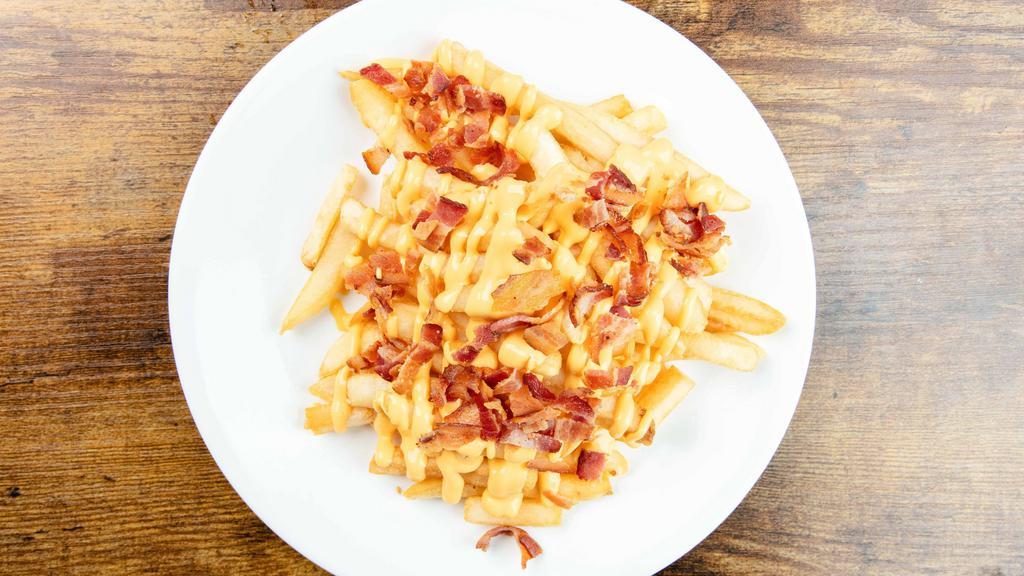Cheese Bacon Fried · Crunchy fries with melted cheese and fried bacon.
