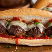Meatball Parmesan Sub Sandwiches · One a fresh baked roll comes our house made meatballs with our own sauce and mozzarella chee...