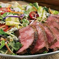 Steakhouse Salad* · Seared center-cut sirloin, mixed greens, Aussie Crunch, tomatoes, red onions, green onions, ...