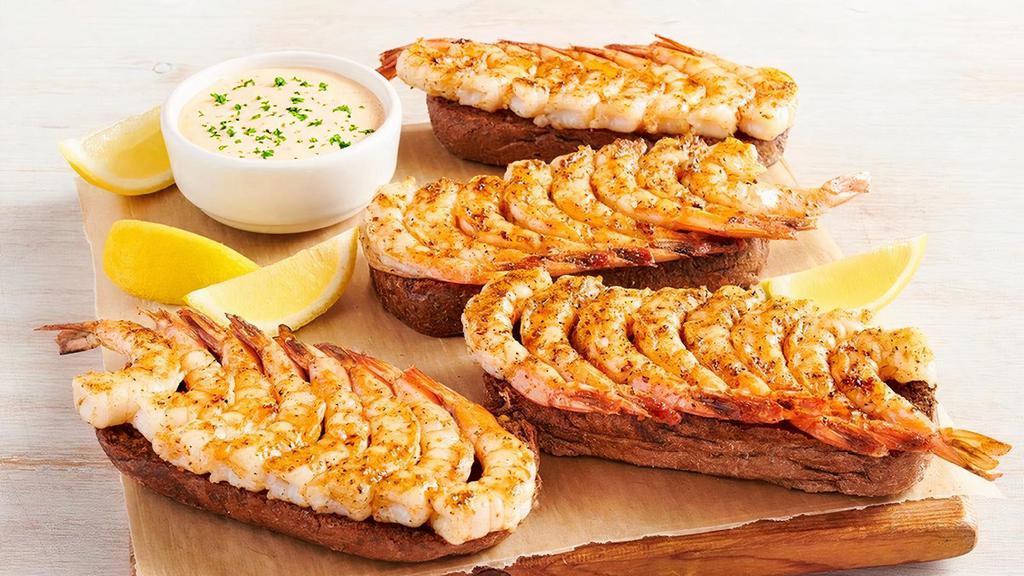 Grilled Shrimp On The Barbie Party Platter · 32 shrimp skewered, seasoned with a special blend of herbs and spices then flame grilled. Served with Outback’s own garlic toast and classic rémoulade sauce. Serves 4 - 6.