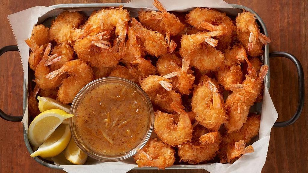 Gold Coast Coconut Shrimp Party Platter · 32 shrimp hand-dipped in batter, rolled in coconut and fried golden. Paired with Creole marmalade. Serves 4 - 6..