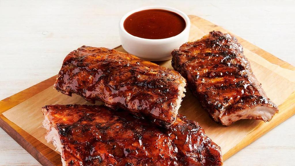 Baby Back Ribs Party Platter · Three 1/2 racks of Baby Back Ribs. Smoked, grilled and brushed with a tangy BBQ sauce. Serves 4 - 6.