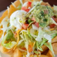 Deluxe Taco Salad · Lettuce, cheese, sour cream, beans guacamole, tomatoes, onions, and black olives. Choice of ...