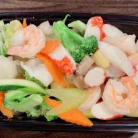 Seafood Delight · An elegant combination of jumbo shrimp, scallop, squid, crab meat sautéed with vegetable in ...