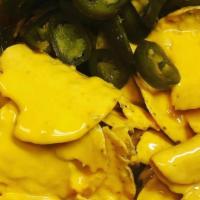 Cheese & Jalapenos Nachos · Cheese and jalapeños.