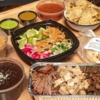 Build Your Own Tacos · Tacos presented in a build your own format.  Includes 1 pound of choice of Protein: Carnitas...