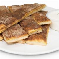 Cinnamon Breadsticks · brushed with butter, topped with cinnamon-sugar mix and vanilla icing