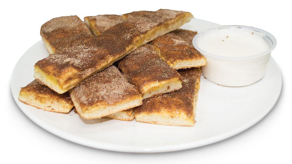 Cinnamon Bread Sticks · brushed with butter. topped with cinnamon-sugar mix and vanilla icing.