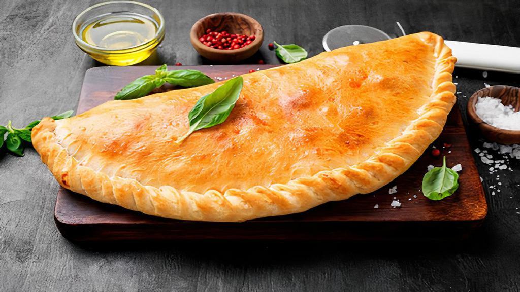 Calzone Gyro · Stuffed with Gyro meat, onins and mozzarella cheese. Served with a side Tzatziki sauce.