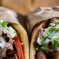Gyro Pita · Sliced gyro meat, lettuce, onions and tomatoes. Served with a side of tzatziki sauce. Served...