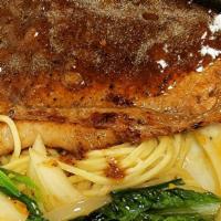 Teppan Steak · Pan fried steak with sauté vegetables and onions on a bed of noodles/rice. Choice of black p...