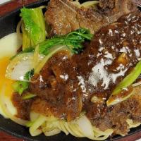 Teppan Pork · Pan fried pork chop with sauté vegetables and onions on a bed of noodles/rice. Choice of bla...