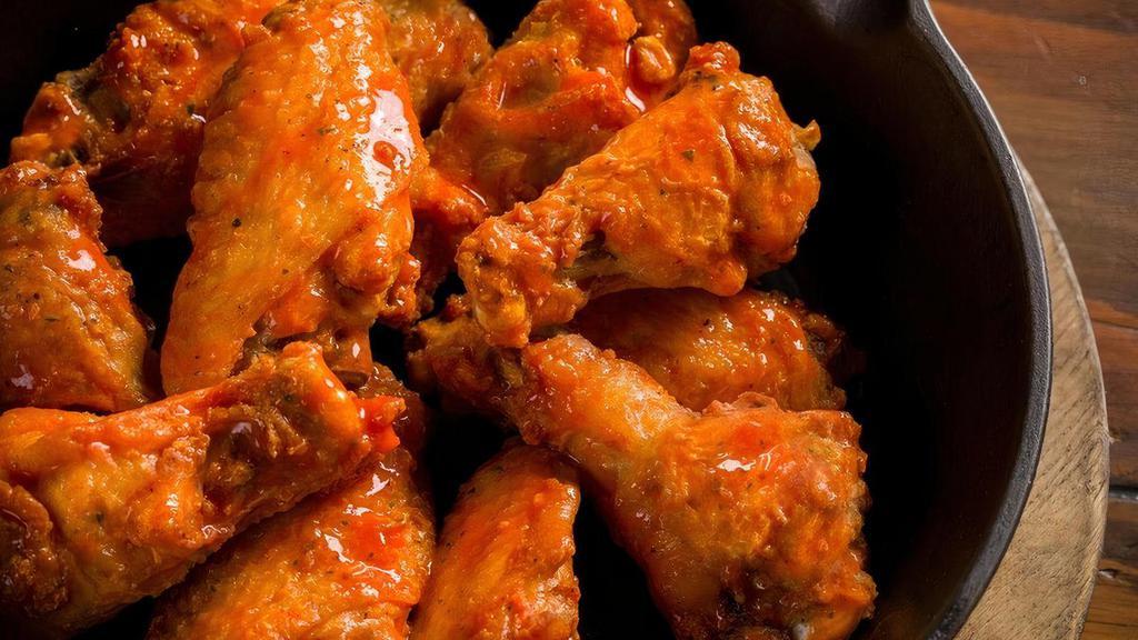 The Rock Wings · Skillet baked and tossed with your choice of ranch season dry rub, hot sauce, sweet red chili sauce or BBQ sauce