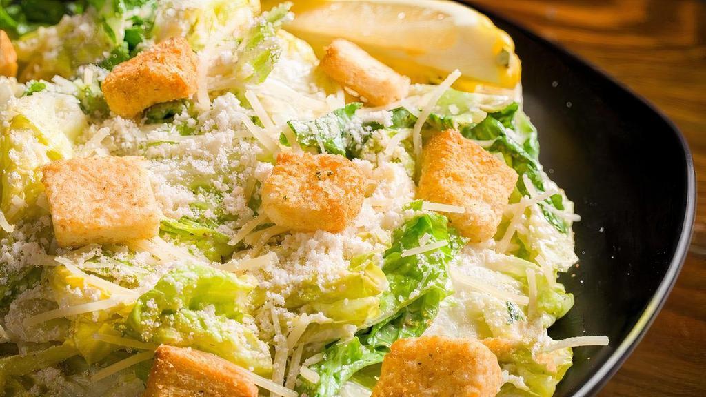 Caesar Salad · Romaine lettuce, Romano cheese, Parmesan cheese, Caesar dressing, garlic croutons