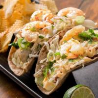 E Street Tacos · Two tacos.  Choice of shredded brisket, house battered fish or sauteed shrimp.   Served with...