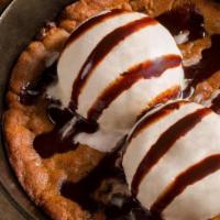 Chocolate Chip Cookie Skillet · Chocolate chip cookie dough, baked in our wood fired oven, topped with two scoops of vanilla...