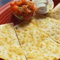 Quesadilla · Large 12” flour tortilla stuffed with Jack and Cheddar cheese, served with salsa and sour cr...