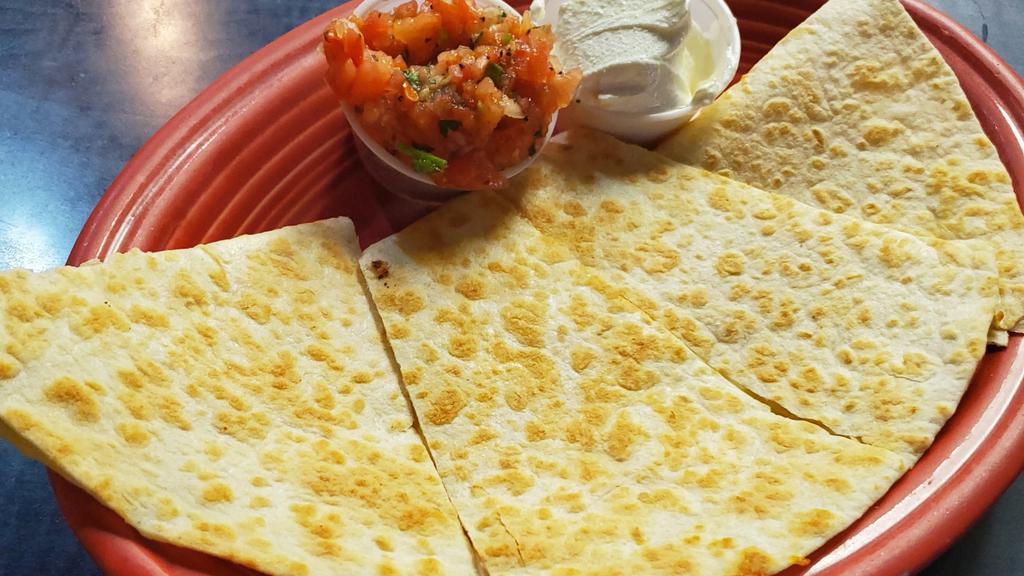 Quesadilla · Large 12” flour tortilla stuffed with Jack and Cheddar cheese, served with salsa and sour cream.