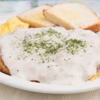 11 Oz. Bigfoot Chicken Fried Steak & Eggs · Our big portion of chicken fried steak, topped with creamy country sausage.  Served with has...
