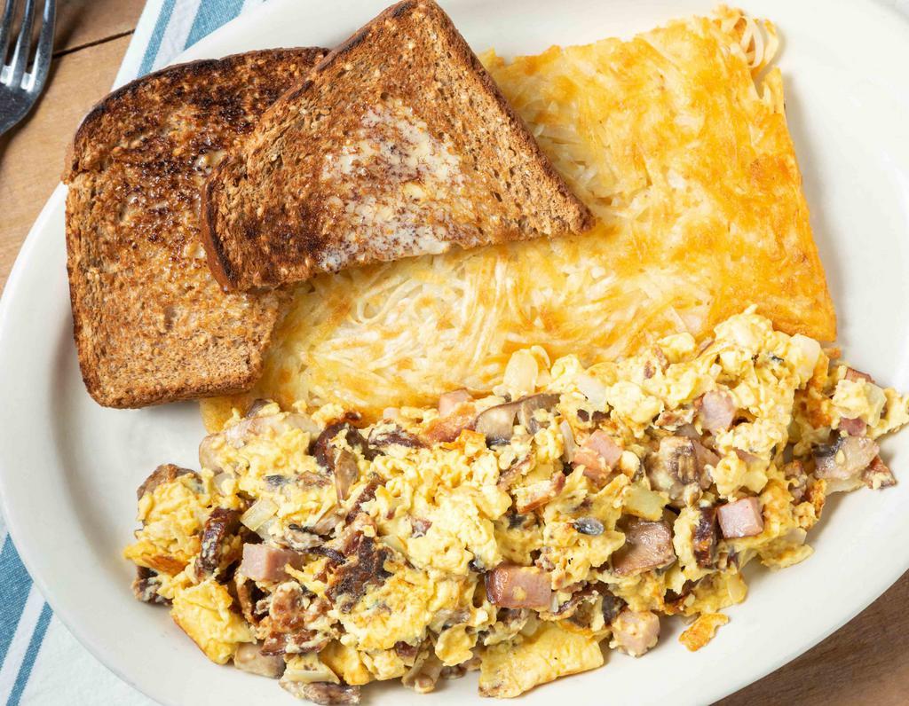 Belltown Scramble · A robust, meaty scramble cooked with ham, bacon, sausages, fresh mushrooms, chopped onions, and cheddar cheese.
