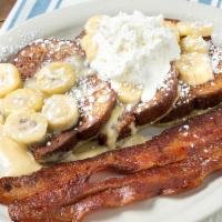 Nutter Butter French Toast · Our famous peanut butter stuffed French Toast.  Served crispy fried, topped with banana slic...