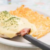 Eggs Benedict · Slices of smoked ham. Served on top of an open-faced English muffin with two soft-poached eg...