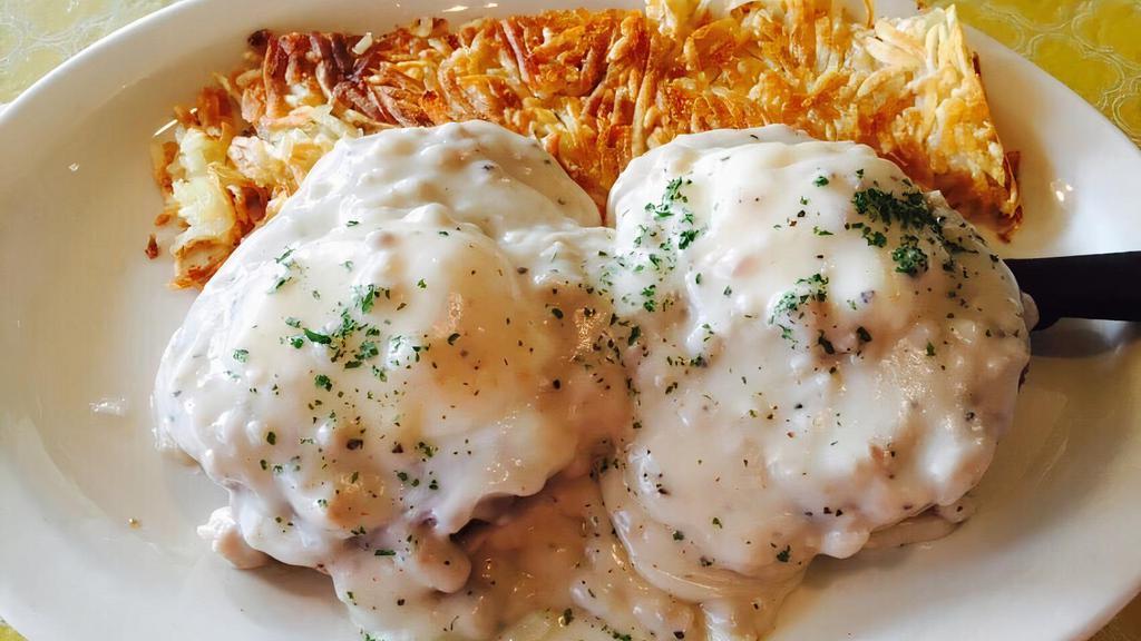Country Benedict · Country sausage and two soft poached eggs on a English muffin, topped with country sausage gravy. Served with hashbrowns or o'brien potatoes and fresh fruit.