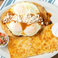 Huevos Rancheros · Two crisp tortillas with three eggs, black beans, ranchero sauce, and queso fresco.