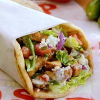 Chicken Shawarma Pita Wrap · Grilled chicken breast seasoned with Shawerma spices, topped with mixed salad, Feta, and gar...
