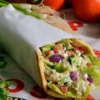 Baba Ghannouj Pita Wrap · Roasted eggplant mixed with, tahini, garlic, spices, topped with mixed salad, and Feta.