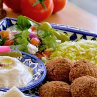 Mediterranean Falafel Plate · Falafel served with a bed of rice, side order of Greek salad, Hummus and Pita.