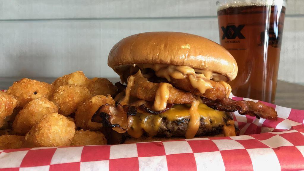 Western Burger · Topped with cheddar cheese, smoked bacon, onion rings and house BBQ sauce.